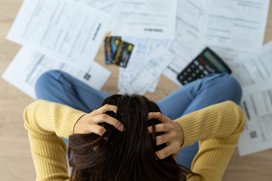 Person Feeling Stressed Over Credit Bills