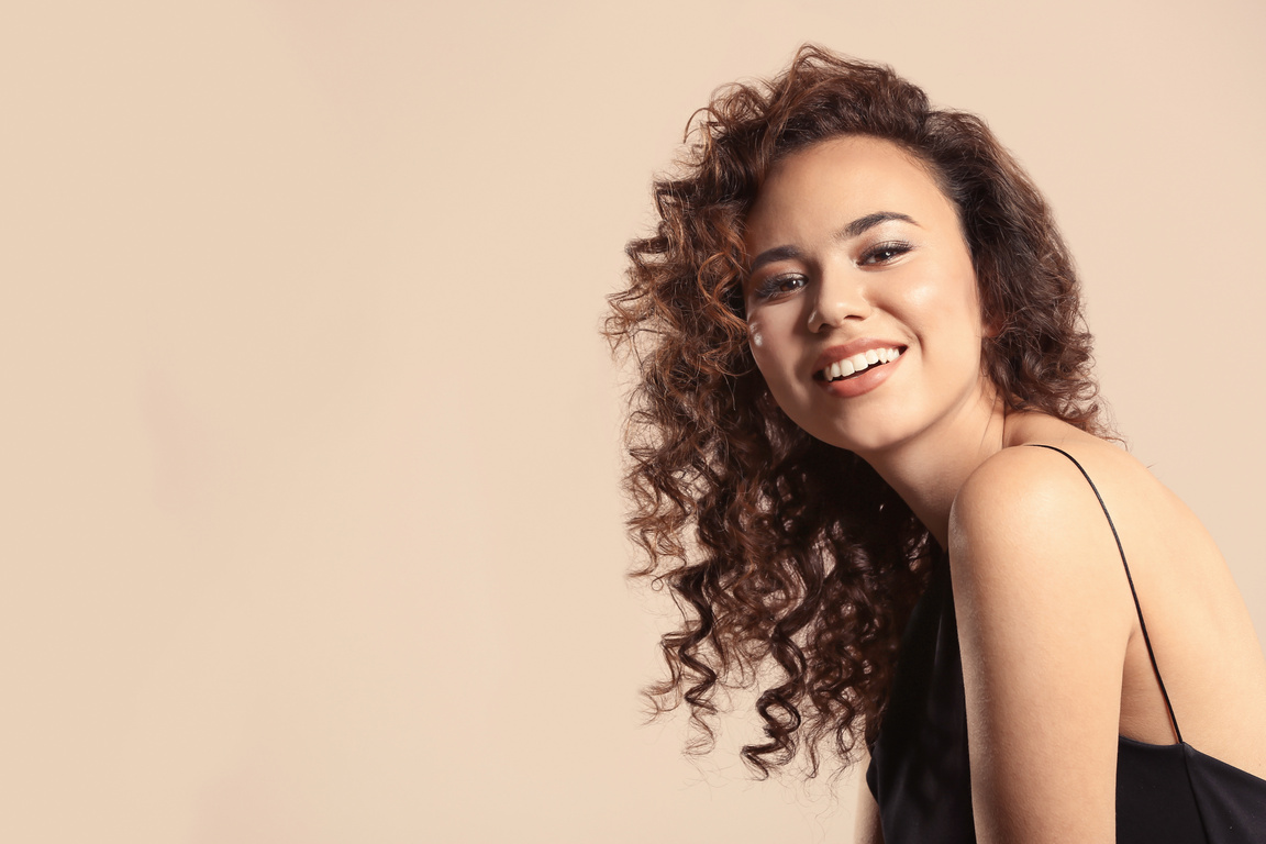 Portrait of a Young Woman with Long Wavy Hair